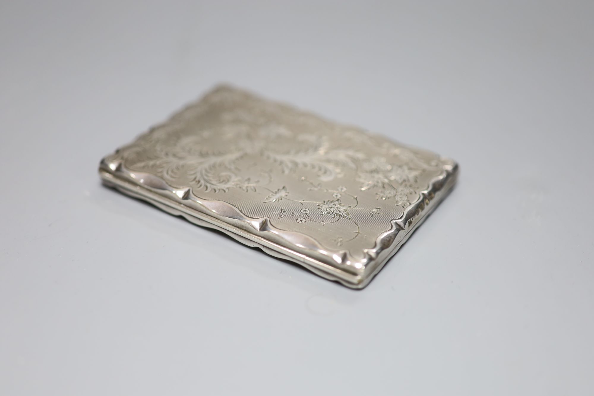 A late Victorian engraved silver card/stamp case, Birmingham, 1890, maker mark rubbed, 10.2cm,